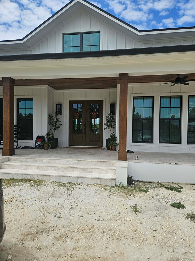 Modern farmhouse front porch with double doors